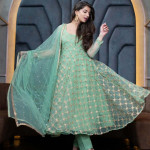 Green and gold-toned semi-stitched dress material